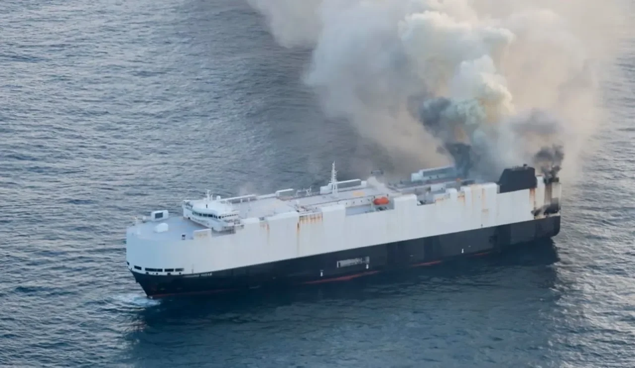 Rescue operation for a burning car carrier in the Pacific Ocean